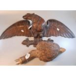 Carved probably walnut study of an eagle with out swept wings, possibly 'Black Forest', together