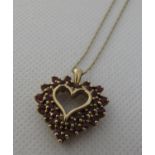 9ct gold ruby set heart pendant on fine link 9ct gold chain. Approx weight 4.1 grams. (B.P. 21% +