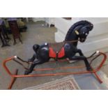 Large plastic rocking horse on tubular metal swing frame. (B.P. 21% + VAT)