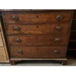 19th century oak straight front chest of four drawers on a projecting base and bracket feet.