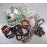 Bag containing assorted bangles, beaded necklaces, gemstone beads etc. (B.P. 21% + VAT)