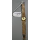 Tissot 9ct gold ladies bracelet dress watch with satin face having baton numerals, and an interwoven