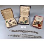 Collection of assorted white metal costume jewellery items in three small cases, some with jade,