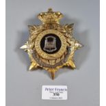 The Suffolk Regiment (QVC) gilt metal helmet plate. Early 20th century. (B.P. 21% + VAT)
