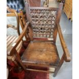 19th century oak farmhouse open armchair, the back with pierced foliate decoration. (B.P. 21% + VAT)