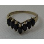 A sapphire set wishbone style ring set in yellow metal. Ring size P&1/2. Approx weight 2.5 grams. (