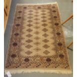 Small beige ground middle eastern design runner, having central lozenge geometric decoration and