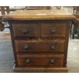 Mahogany miniature apprentice straight front chest of two short and two long drawers with ebonised