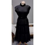 Two 1950's/60's vintage black party dresses; one has pleated detail and the other has velvet stripes