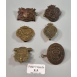 Small collection of British Military Volunteer Battalion cap badges, including: Caernarvonshire