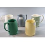 Four Wedgwood tankards by 'Keith Murray' together with a similar marked 'Wedgwood' of a 'Etruria and