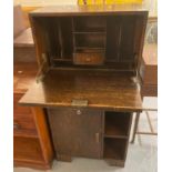 Art Deco oak narrow bureau with under drawer and shelves. (B.P. 21% + VAT)