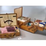 Mid century folding ladies sewing box with accessories together with a small miniature leather