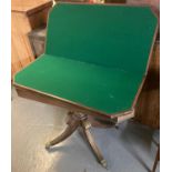 19th century mahogany folding card table with brass inlay on quatrefoil base with brass paws and