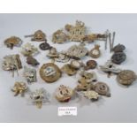Bag of assorted British military cap badges, various including: West Yorkshire, Queen's Own Hussars,