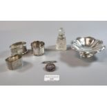 Small silver bonbon dish together with three silver napkin rings, a silver topped and glass dressing