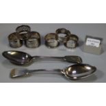 Two plated fiddle pattern basting spoons and a group of six napkin rings, five being hallmarked