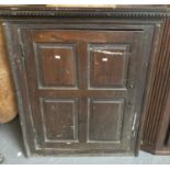 19th century oak hanging corner cupboard, the single door with four rectangular fielded panels. (B.