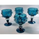 Set of four large blue goblets decorated with moulded roundels. (4) (B.P. 21% + VAT)