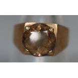 9ct gold dress ring set with a brown stone. Ring size N&1/2. Approx weight 3.2 grams. (B.P. 21% +