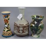 Gwili Pottery 'Grape and Vine' vase, together with an Art Pottery mallet shaped 'Rye' vase and a '