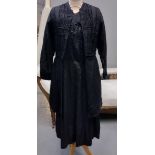 Early 20th Century long sleeved black dress with brocade detail, together with a Victorian cotton