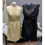 Two vintage 60's brocade sleeveless shift dresses; one dark green with copper abstract pattern and a