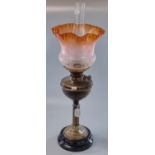 Early 20th century double oil burner lamp having frosted orange etched floral shade with a brass