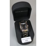 An Emporio Armani gents steel rectangular faced wristwatch appearing in un-used condition,