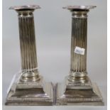 Pair of early 20th century silver Corinthian Column candlesticks with loaded bases, makers mark 'T A