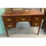 19th century mahogany knee hole dressing table/desk, having an arrangement of five drawers on square