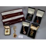 A collection of enamel coins, one on 9ct gold chain. (B.P. 21% + VAT)