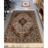 Persian design multi-coloured floral and foliate carpet with central medallion together with a