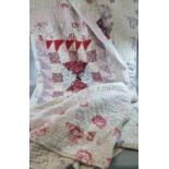 Vintage cotton patchwork quilt with various fabrics, floral print to reverse. (B.P. 21% + VAT)