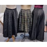 Three vintage 40's-60's skirts; one black damask with bow pattern, one black ground plaid and a long