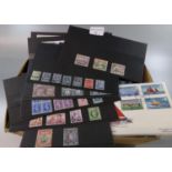 Box with all world selection of mint and used stamps on cards, in packets, covers etc. (B.P. 21% +