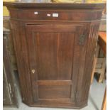 19th century ok single door blind panelled hanging corner cupboard, the interior revealing shaped