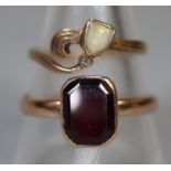 9ct gold red stone ring together with a yellow metal ring set with a baby's tooth. Ring size W&1/2