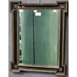 Aesthetic design gilt and ebonised bevel plate wall mirror with projecting angles. Overall 49x40cm