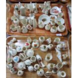Two trays of crested souvenir ware items to include: vases, miniature teapots, boots, shell,