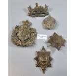 Assorted British military helmet plates, including: Coldstream Guards, Sutherland Highlanders,