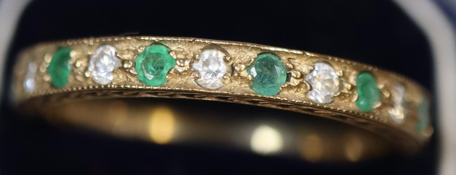 A 9ct gold half eternity style ring set with green and white stones. Ring size N. Approx weight 1. - Image 2 of 4