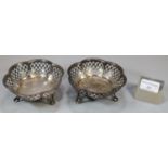 Pair of silver bonbon dishes with pierced decoration standing on three stylised feet. Chester