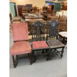 Two similar late Victorian ornately carved oak hall chairs together with another early 20th