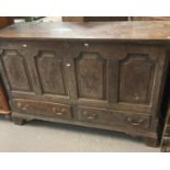 18th century Welsh oak coffer, the moulded top above four fielded panels, two fitted drawers on a