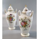 Pair of Minton bone china two handled lidded vases, the body decorated with floral sprays. Height