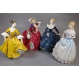 Four Royal Doulton bone china figurines, to include: 'Autumn Breezes', 'Fragrance', 'Stephanie'