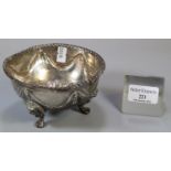 19th century silver bowl, overall with repoussé swags and foliage, standing on three lion mask