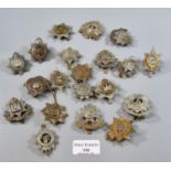 Collection of assorted British military cap badges, to include: East Yorkshire, Bedfordshire and