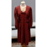 Two vintage 1940's burgundy colour day dresses; one with bow and button detail down the front, the